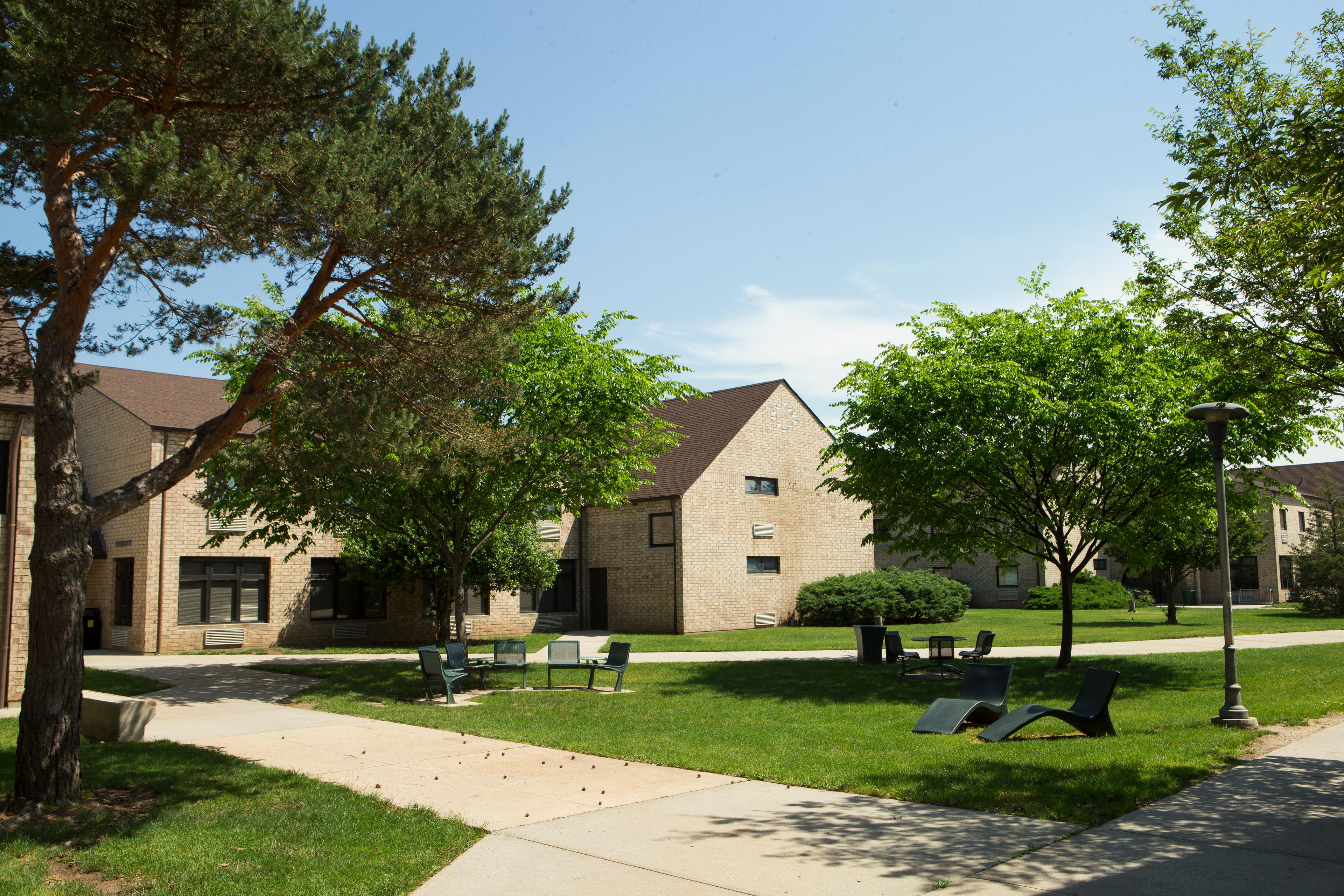 Hofstra campus exterior with building and trees_36527.jpg