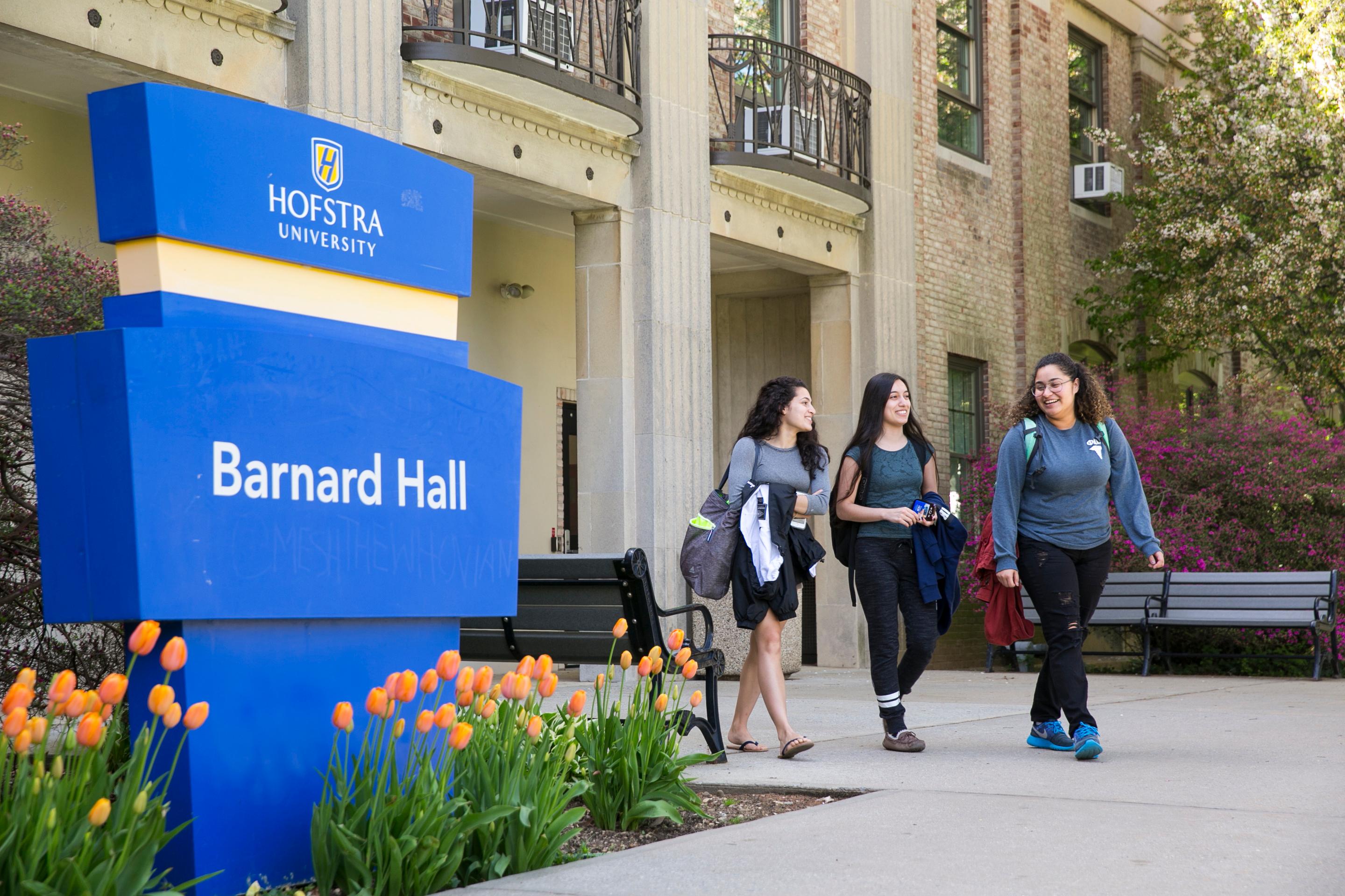 Hofstra three female students exiting the Barnard Hall_36517.jpg