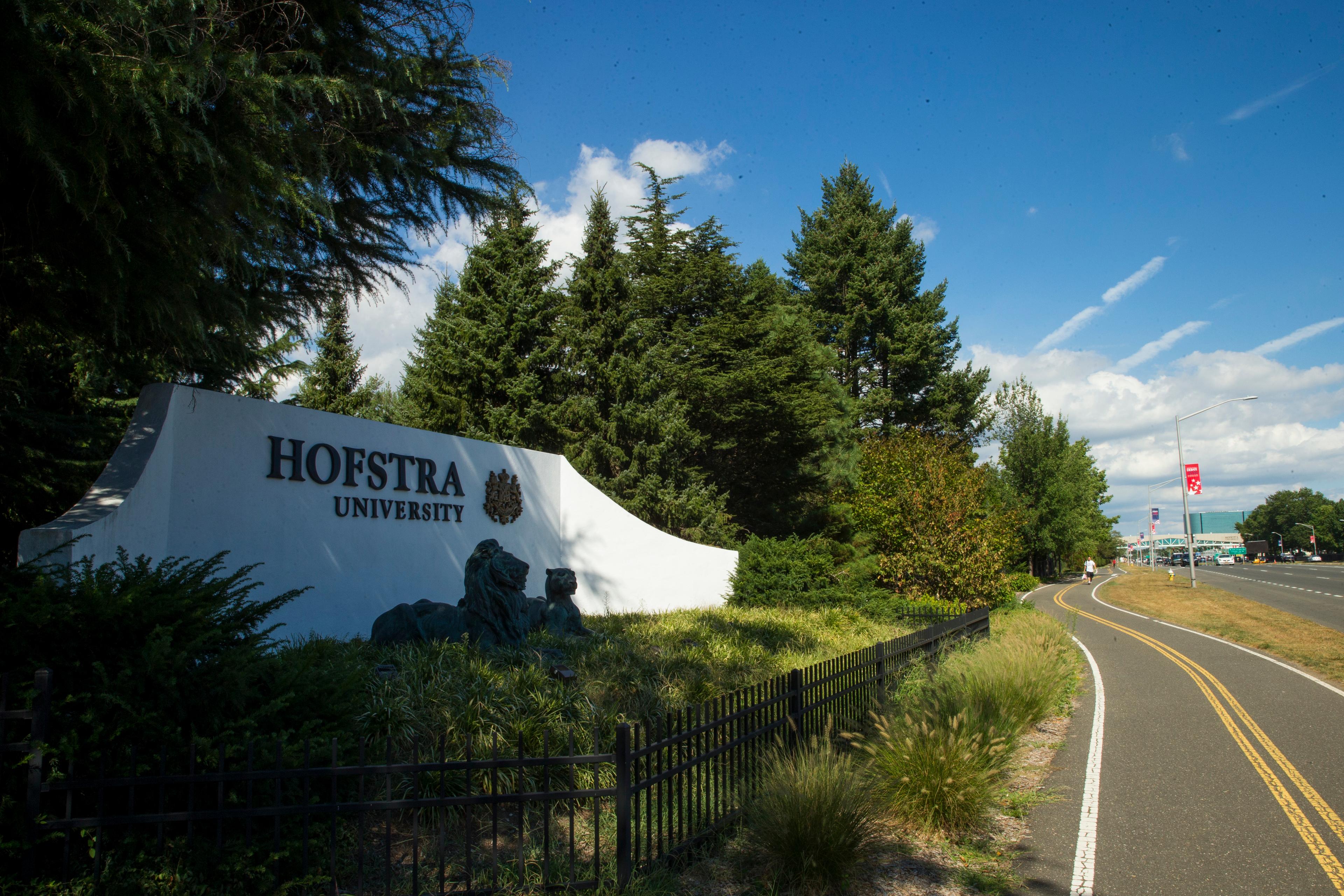 Hofstra view from the entrance of the university with the name mural close to a bike road_36514.jpg